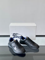 Burberry lace-up sneakers, dark leather with blue interior and embossed side logo