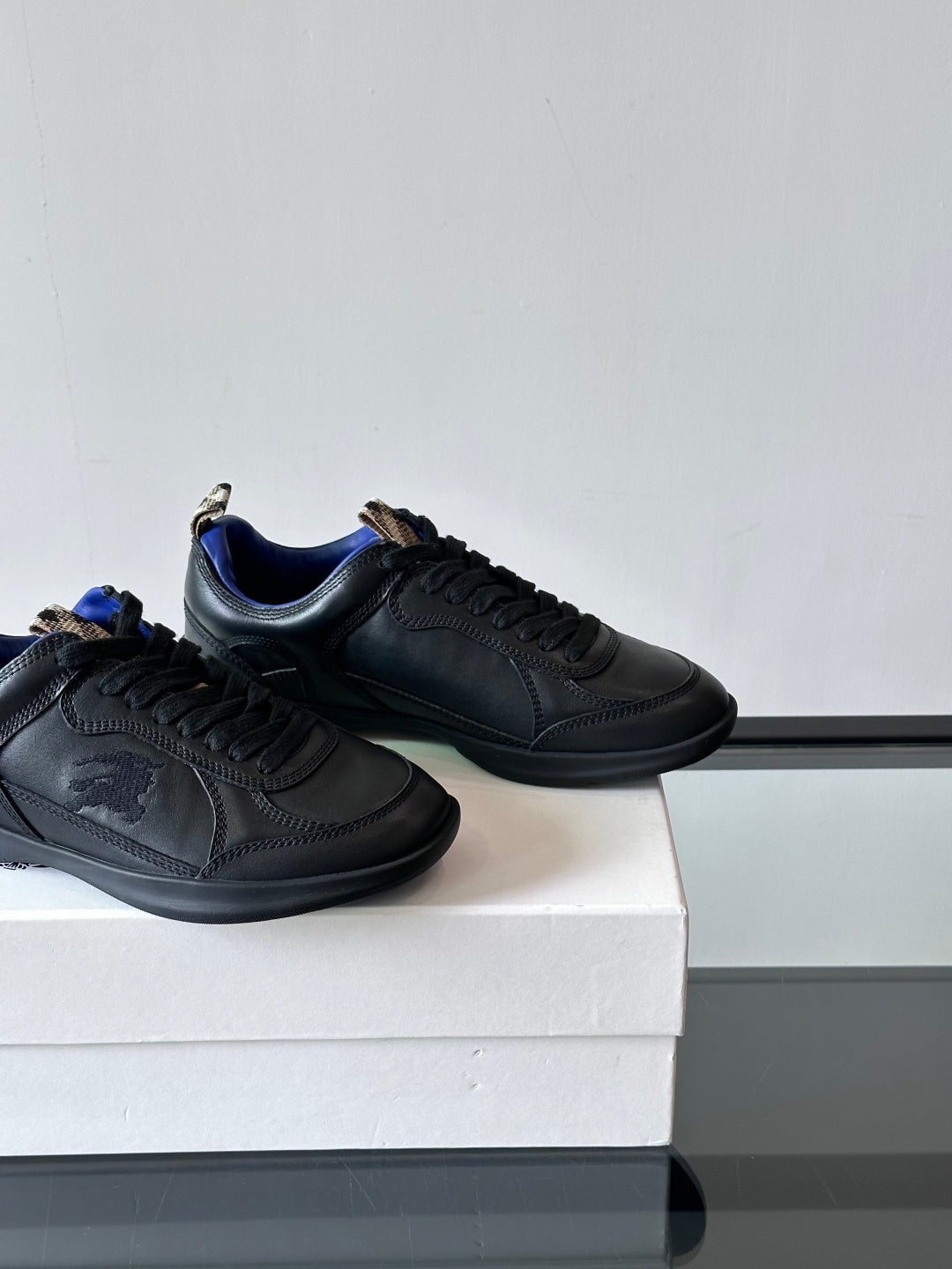 Burberry lace-up sneakers pair, dark leather with blue-trim collar
