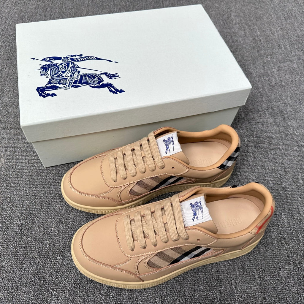 Beige low-top sneakers with lace-up front, blue-and-white plaid detail, rubber sole
