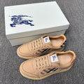Beige low-top sneakers with lace-up front, blue-and-white plaid detail, rubber sole