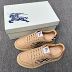 Beige low-top sneakers with lace-up front, blue-and-white plaid detail, rubber sole