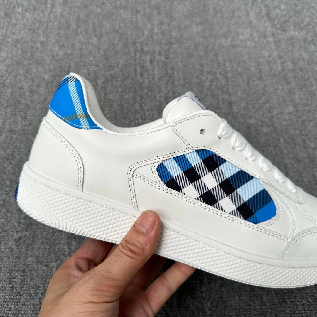 Burberry luxury white sneaker with check panel detail and textured white midsole