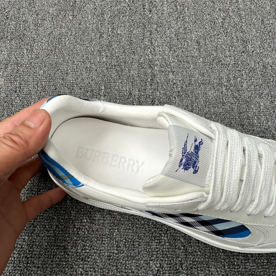 Burberry luxury white sneaker interior with embossed Burberry lettering on the tongue