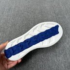 Burberry luxury white sneaker outsole with blue tread pattern visible