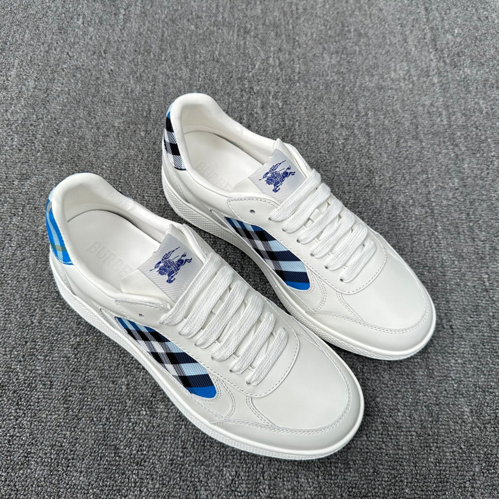 Burberry luxury white low-top sneakers with blue-and-black check details on sides