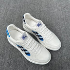Burberry luxury white low-top sneakers with blue-and-black check details on sides
