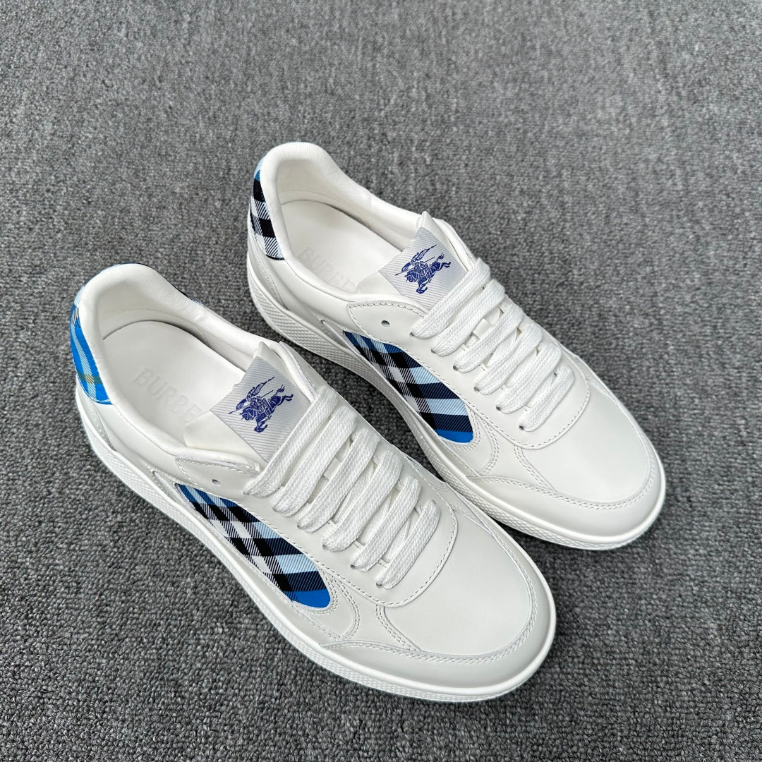 Burberry luxury white low-top sneakers with blue-and-black check details on sides