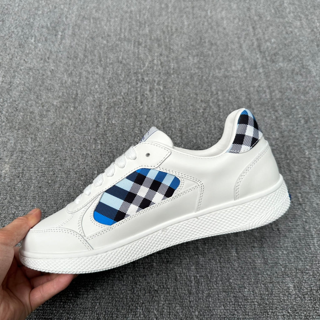 Burberry luxury white sneakers with blue-and-black check panel and textured white sole