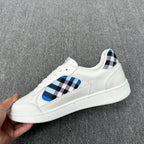 Burberry luxury white sneakers with blue-and-black check panel and textured white sole