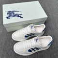 Burberry luxury white sneakers with blue and black check side panel and lace-up design
