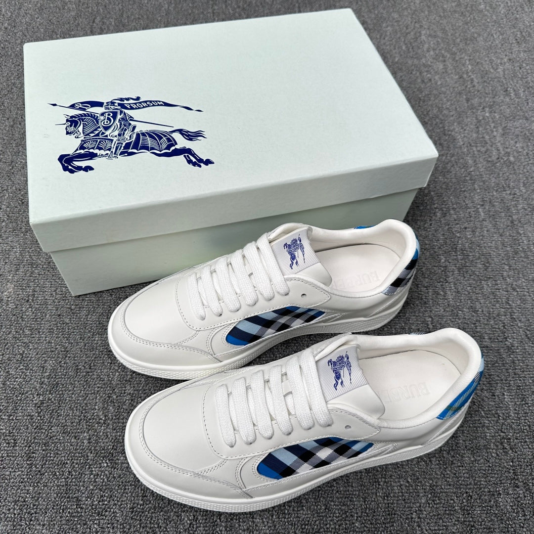 Burberry luxury white sneakers with blue and black check side panel and lace-up design