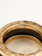 Close-up gold-tone ring showing 'MADE IN ITALY' text on inner band