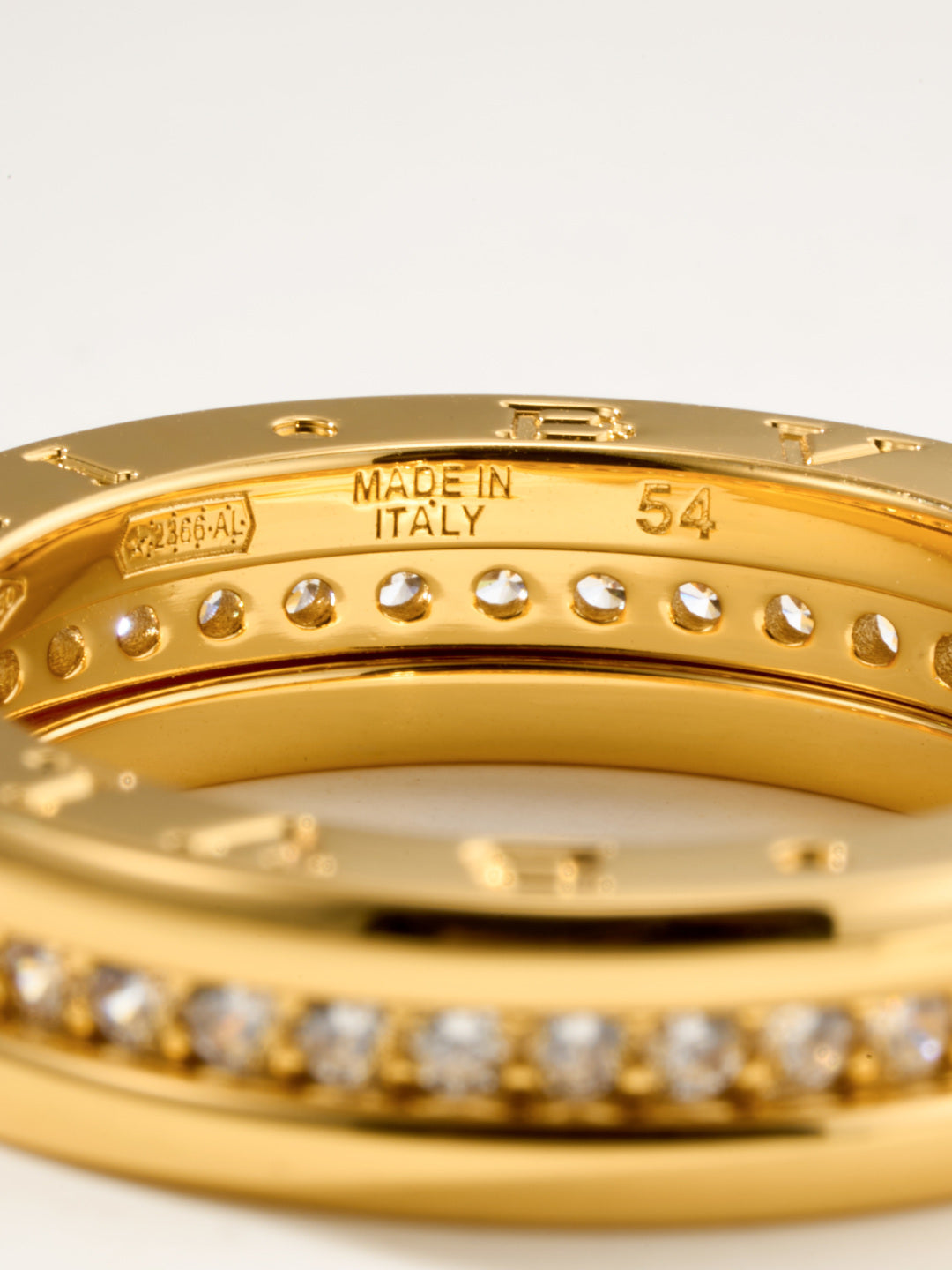 Bvlgari gold-tone bracelet with MADE IN ITALY text and round stones, close-up