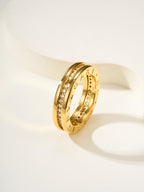 Gold multi-row ring with small gemstone details and engraved inner band