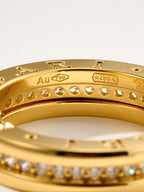 Bvlgari gold-tone bracelet with Au 750 marking and small round stones, close-up