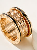 Bvlgari gold-tone ring close-up, diamond-cut textured outer band details