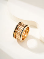 Bvlgari gold-tone ring with ridged diamond-pattern outer bands, side view