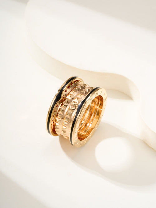 Bvlgari gold-tone ring with ridged diamond-pattern outer bands, side view