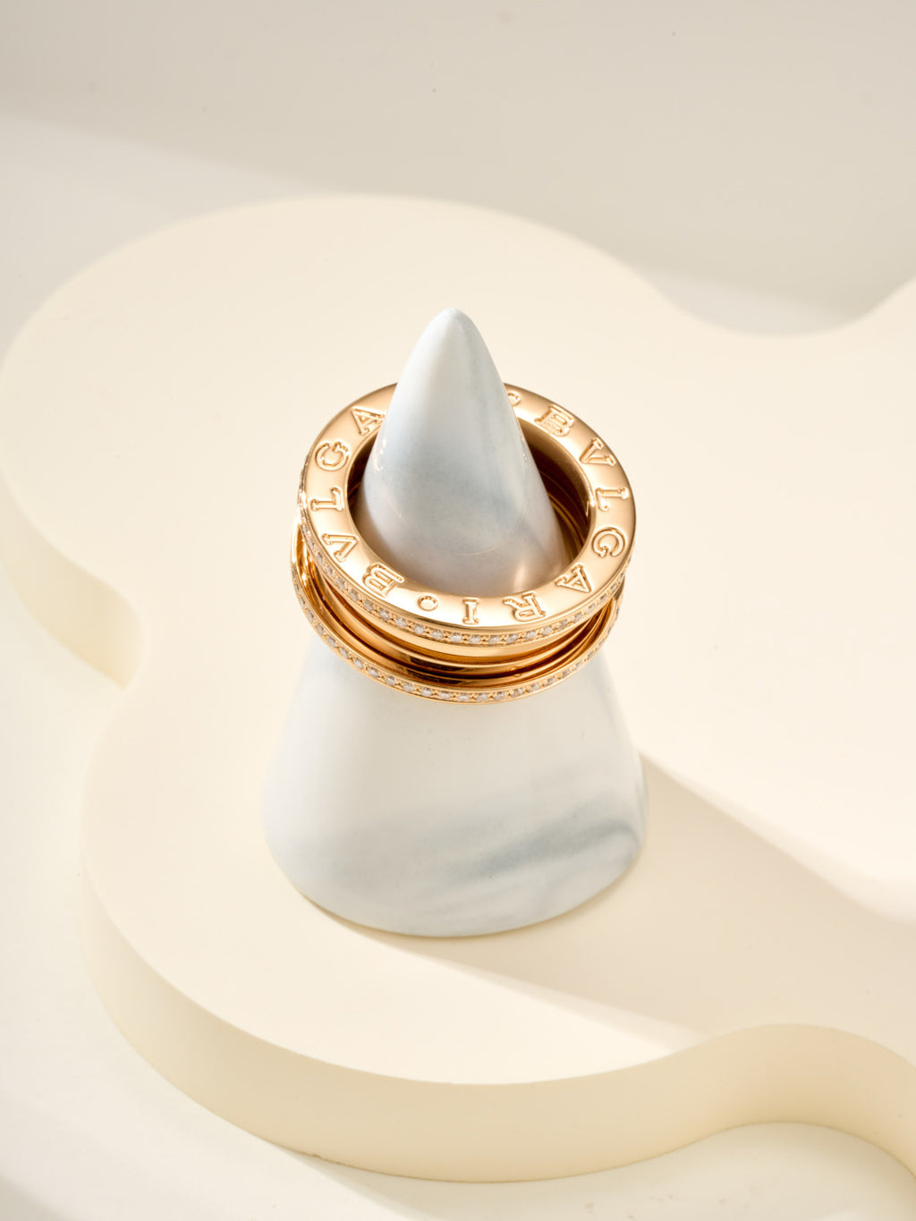 Gold ring with diamond pavé detail around the top edge, engraved interior