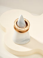 Gold ring with diamond pavé detail around the top edge, engraved interior