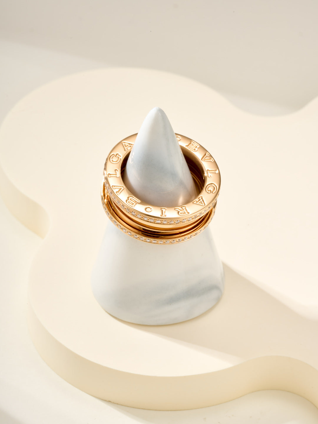 Gold ring with diamond pavé detail around the top edge, engraved interior