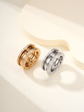 Stacked ring set with gold and silver bands, each with diamond pavé detailing