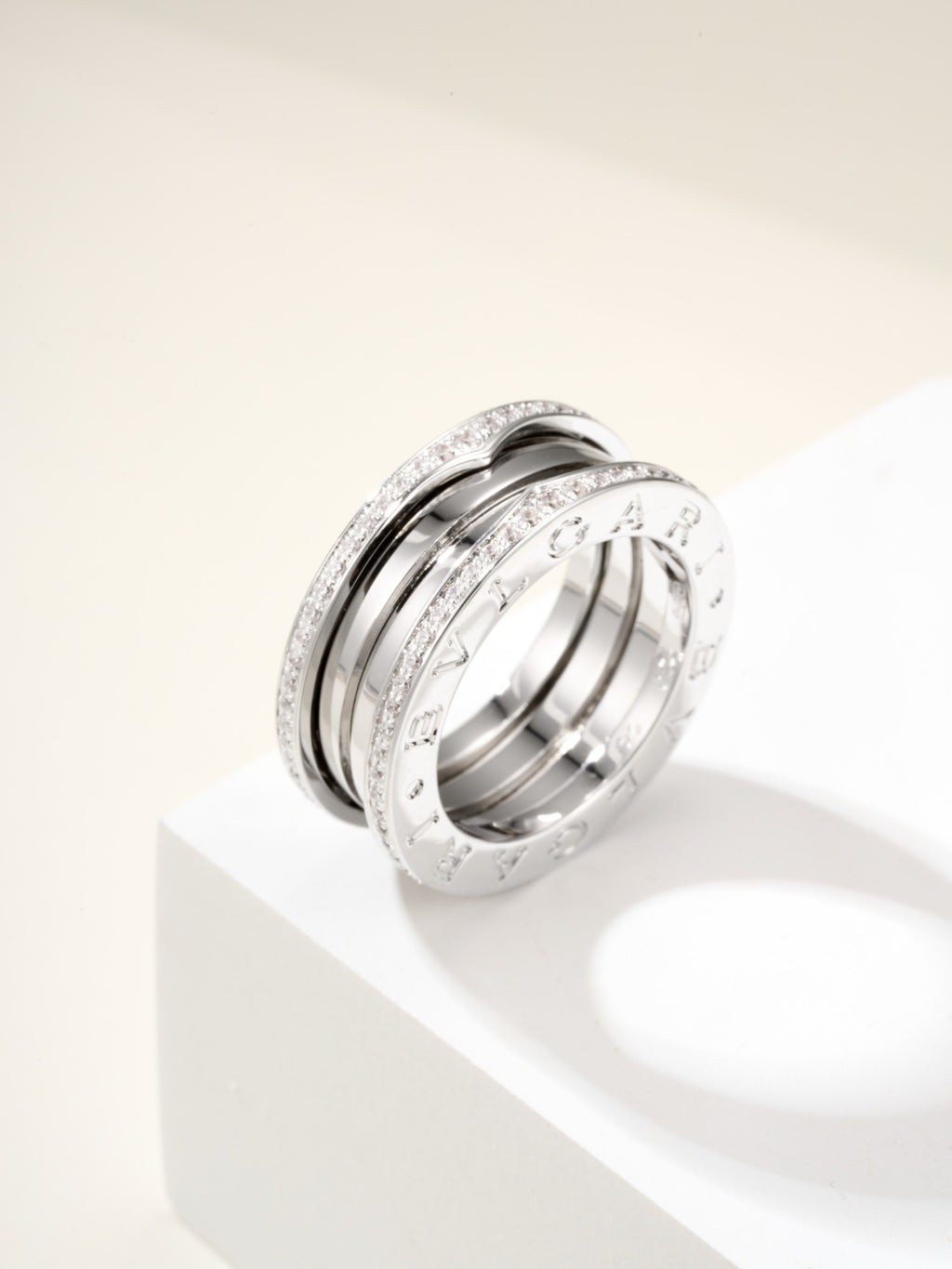 Silver band ring with diamond pavé edge detailing and engraved inner rim