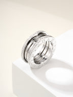 Silver band ring with diamond pavé edge detailing and engraved inner rim