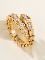 Bvlgari diamond ring, gold-tone linked band with square-cut stones, close-up angle