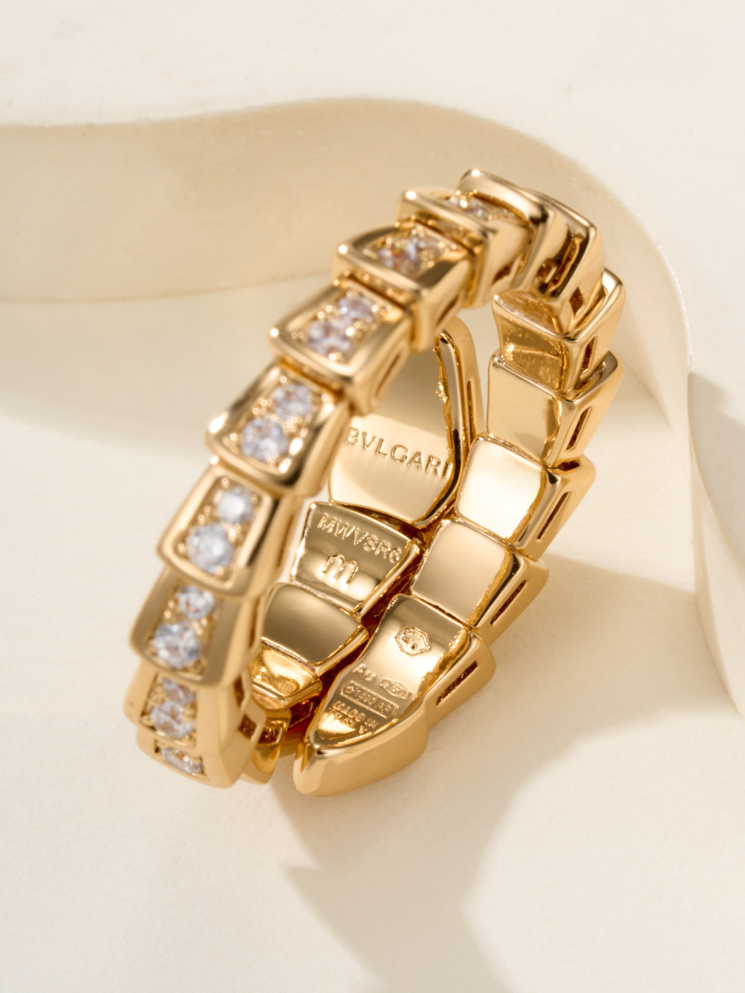 Bvlgari diamond ring, gold-tone linked band with square-cut stones, inside logo visible