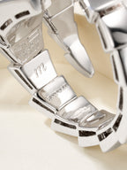 Bvlgari watch bracelet close-up in silver-tone with engraved details and pavé accents