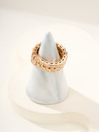 Bvlgari gold-tone pavé band ring on a ring stand, square crystal settings