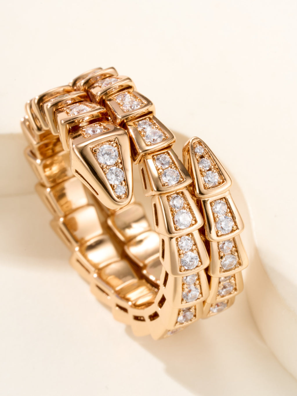 Bvlgari gold-tone pavé band ring close-up with square crystal bands