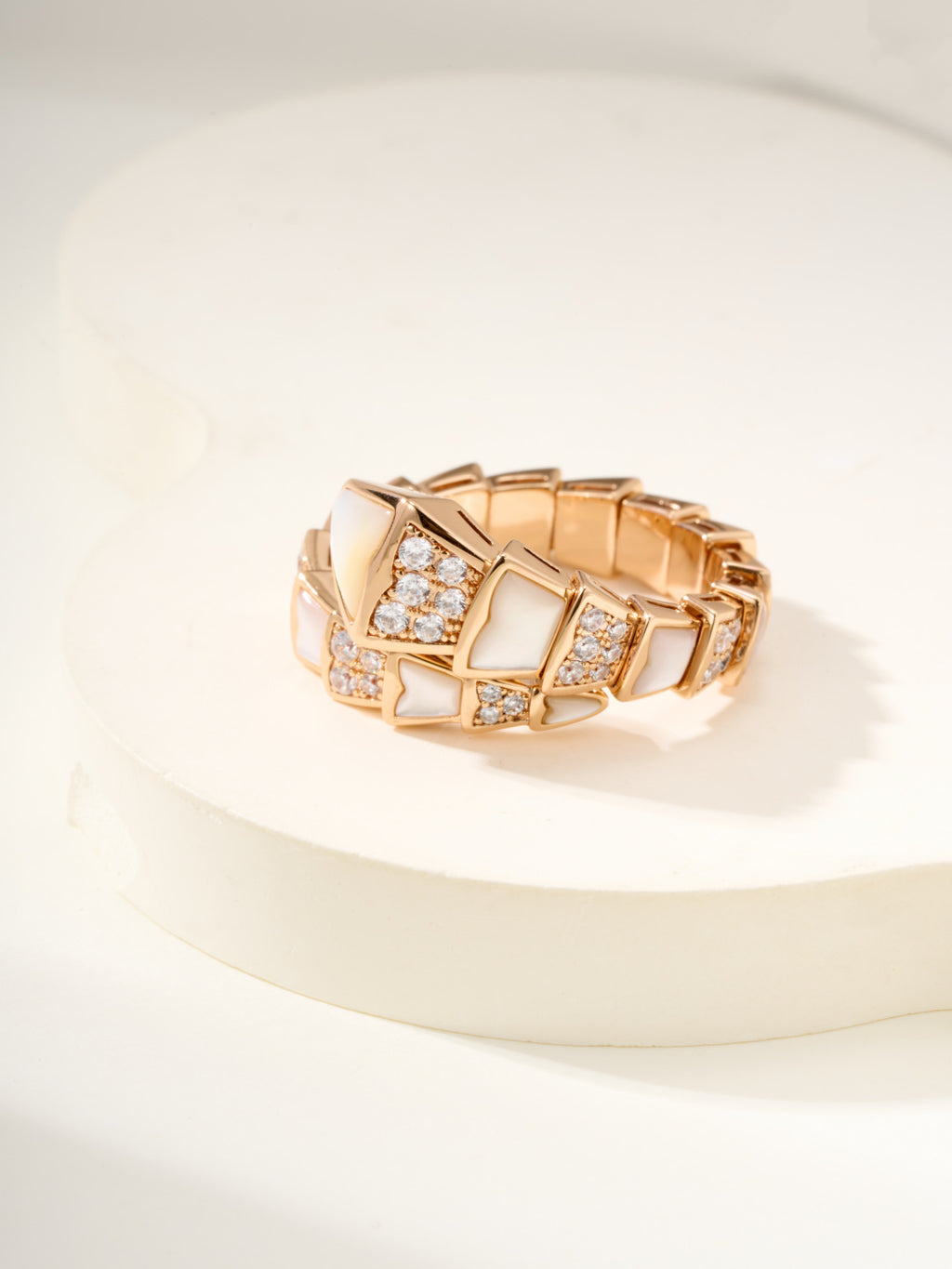 Rose gold-tone bracelet with central square crystal panel and matching geometric links