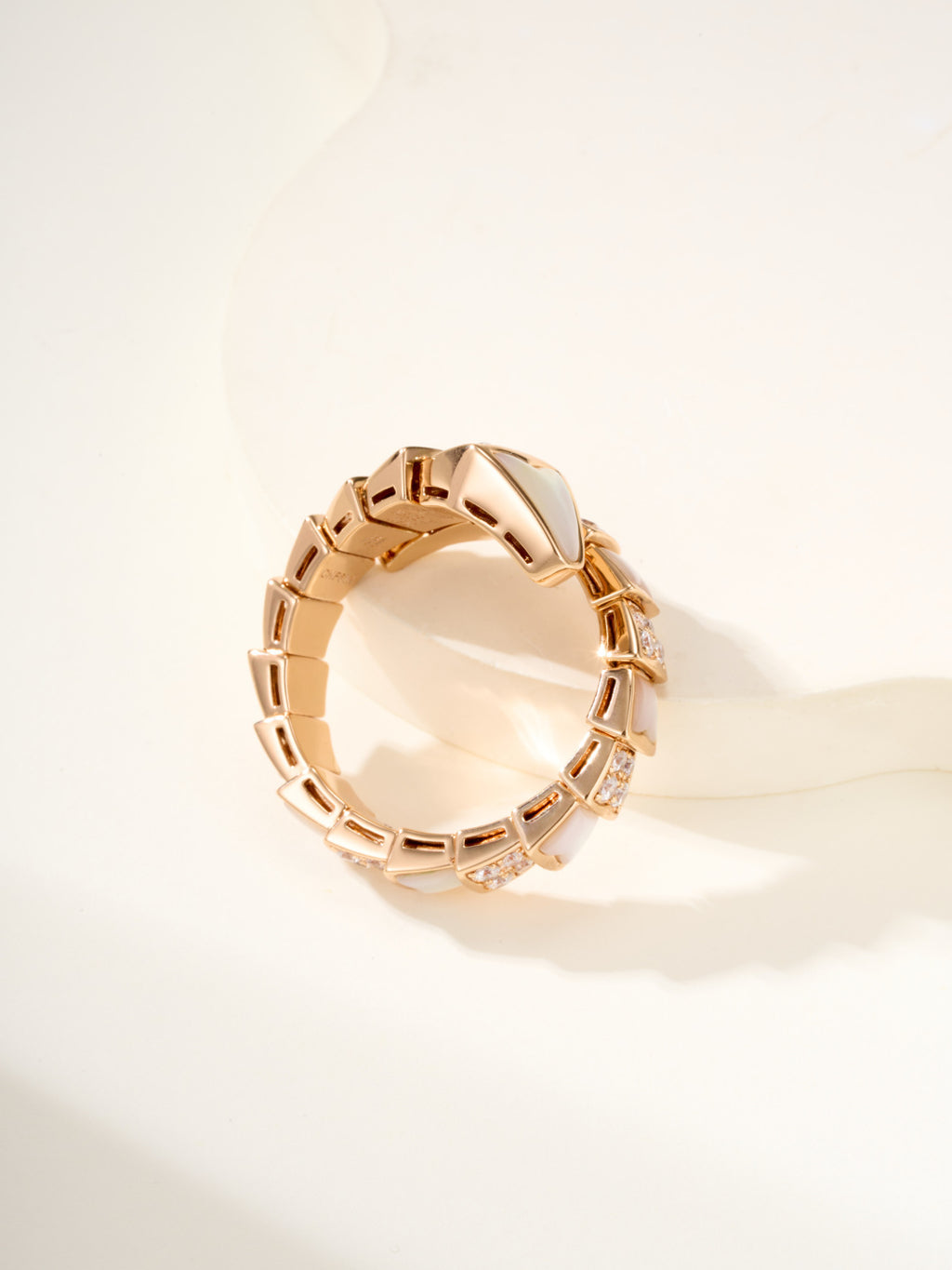 Rose gold-tone open cuff bracelet with geometric link band and small crystal details