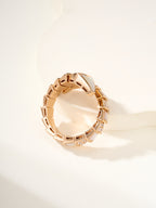 Rose gold-tone open cuff bracelet with geometric link band and small crystal details