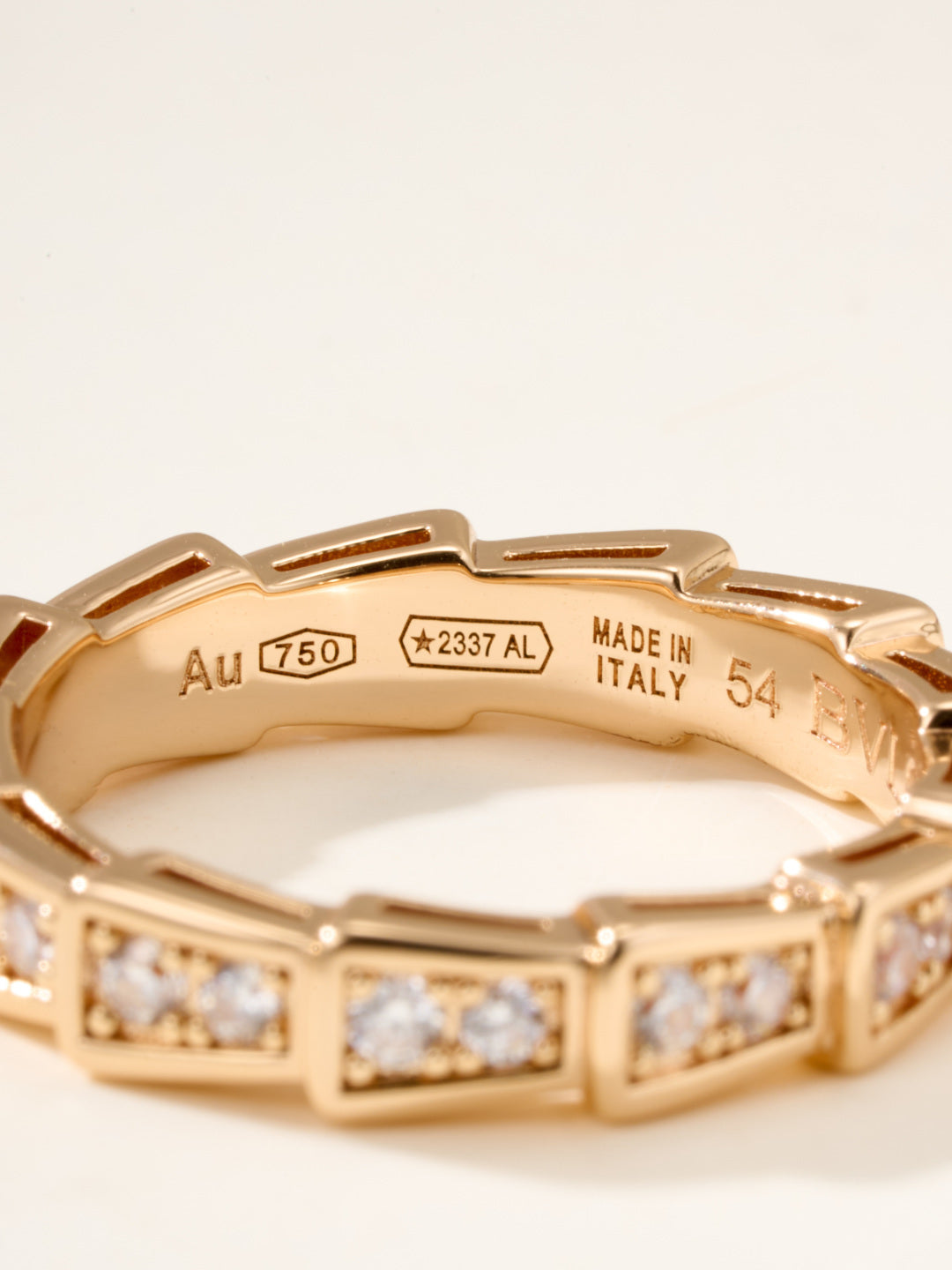 Gold bangle interior engraving showing “Au 750” and “Made in Italy 54”.