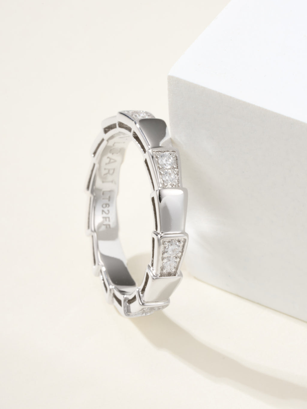 Bvlgari silver bangle bracelet, side view of raised gem square links