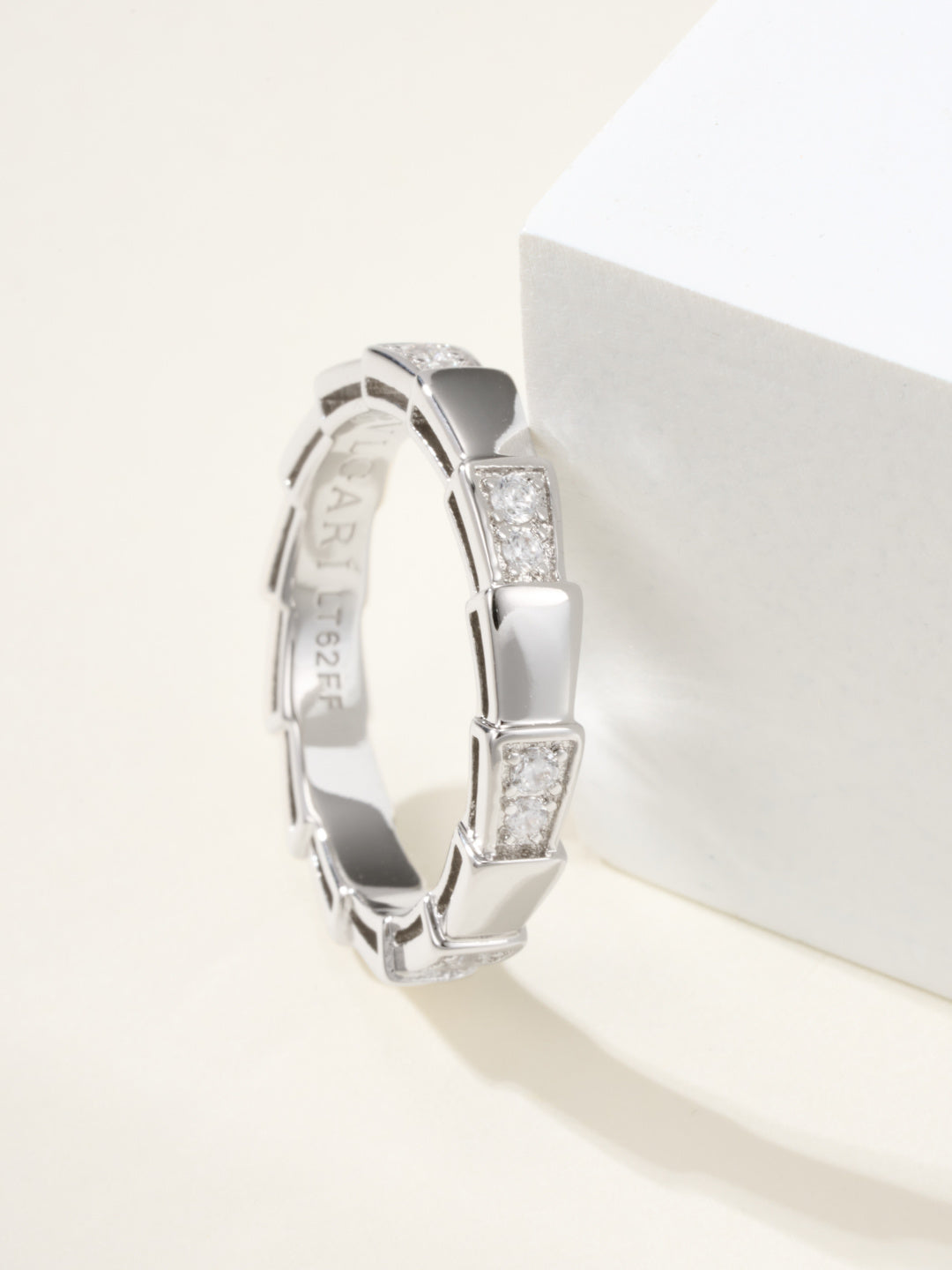 Bvlgari silver bangle bracelet, side view of raised gem square links