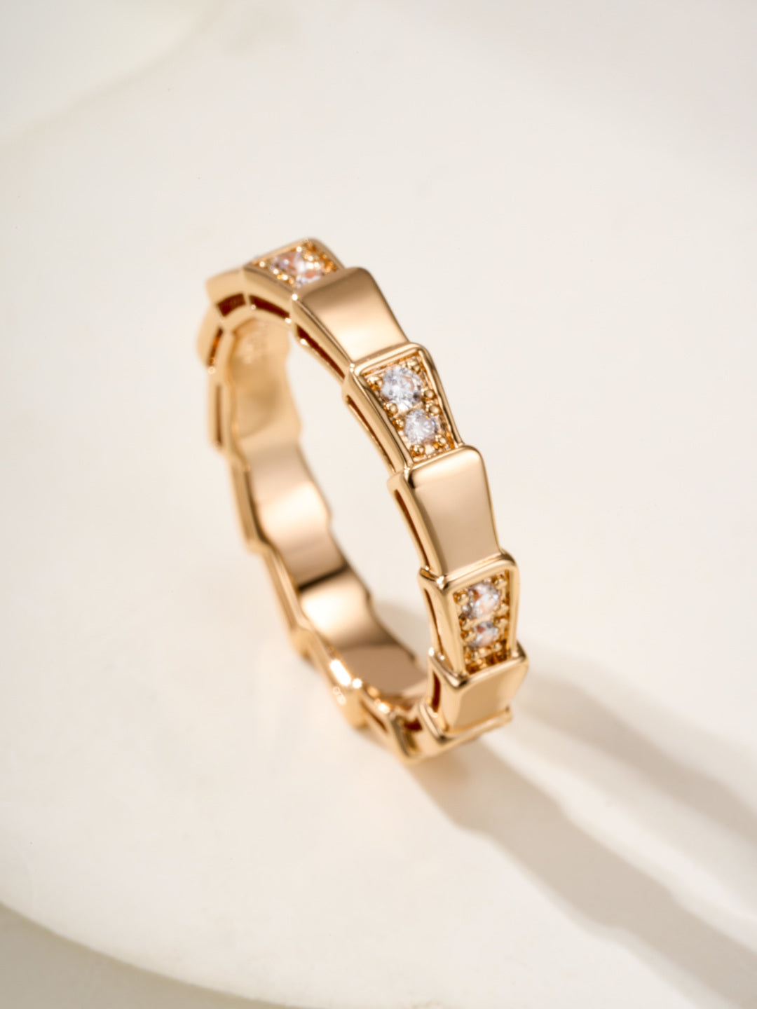 Bvlgari gold bangle bracelet, side view of raised gem square links