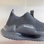 Moncler knit sneaker upper close-up with MONCLER logo and textured stitching