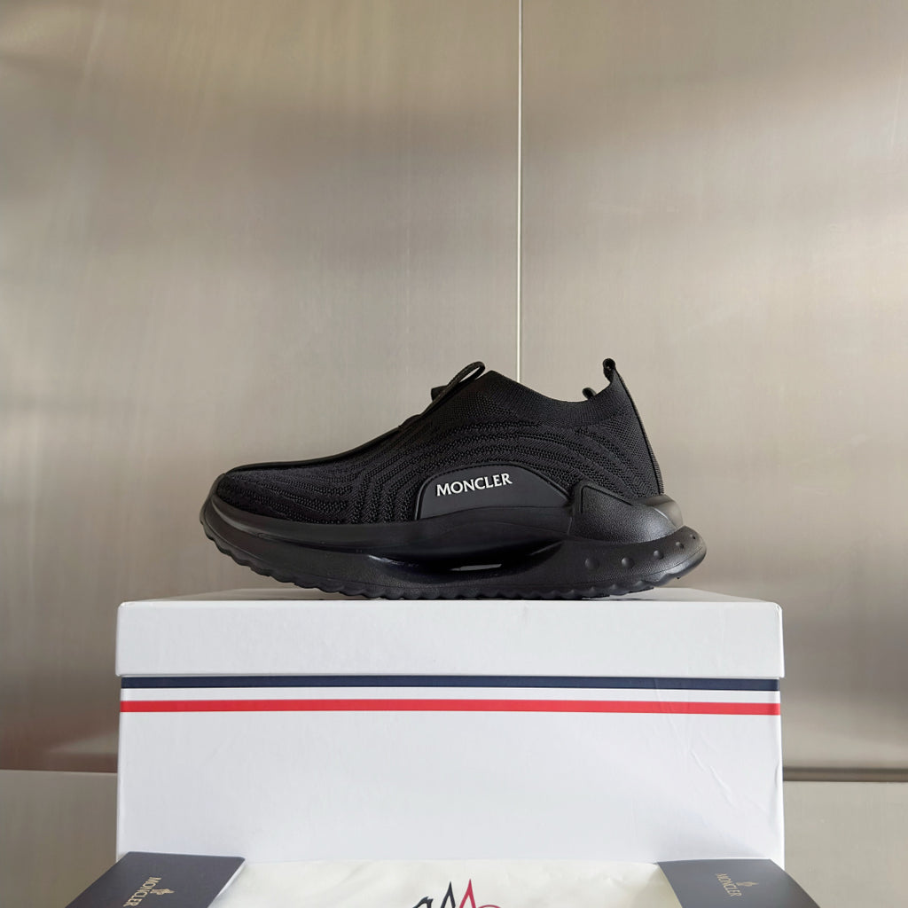 Moncler low-top slip-on sneaker with dark knit upper and sculpted rubber sole