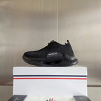 Moncler low-top slip-on sneaker with dark knit upper and sculpted rubber sole