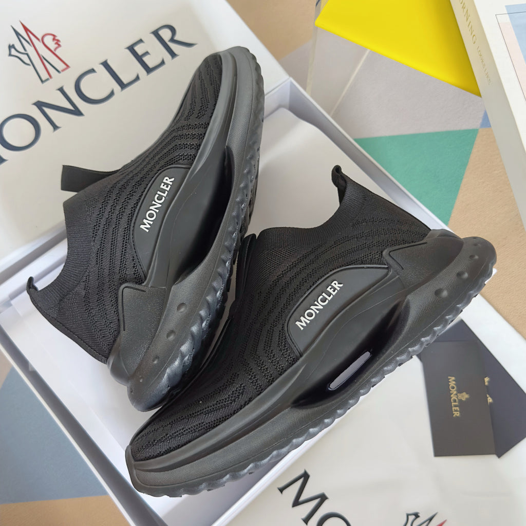 Moncler slip-on knit sneakers, side and heel view with dark sole tread