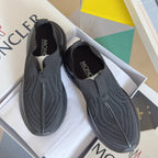 Moncler slip-on knit sneakers, dark textured upper and cushioned sole