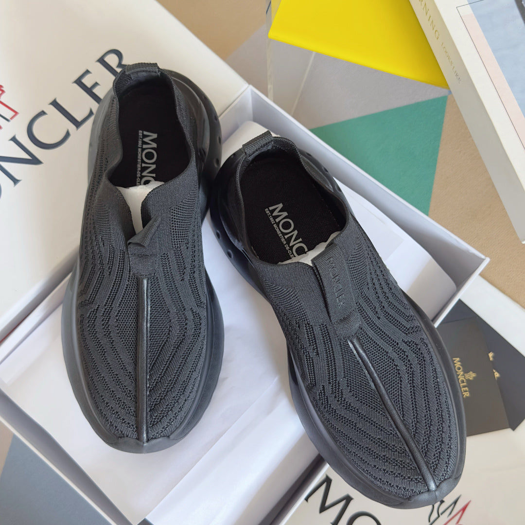 Moncler slip-on knit sneakers, dark textured upper and cushioned sole