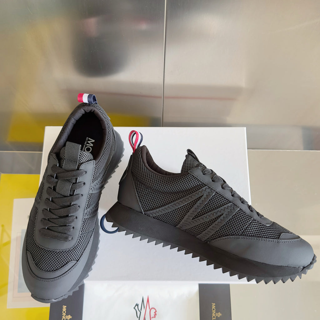 Moncler low-top sneakers in dark gray with lace-up closure and chunky zigzag sole.