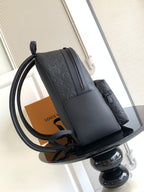 Louis Vuitton monogram backpack with front flap and curved shoulder strap, side view
