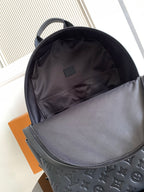 Louis Vuitton mini backpack open top showing interior lining pocket