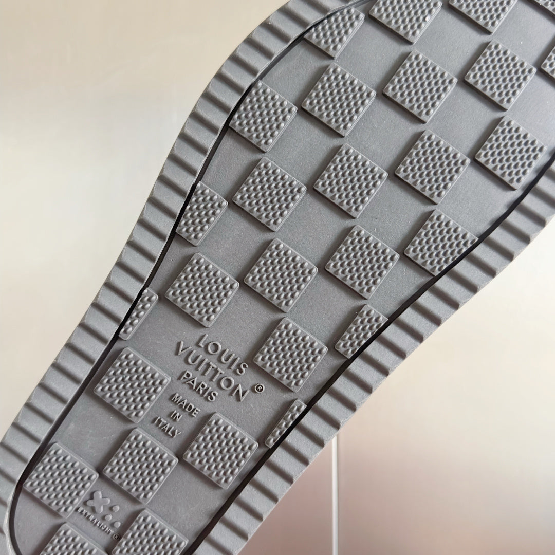 Grey rubber outsole for Louis Vuitton slide sandal with embossed monogram grip